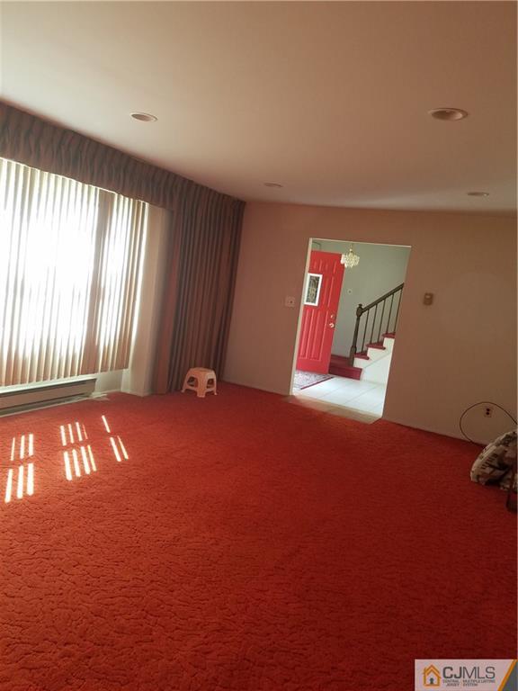 7 Stradford Road Sayreville, NJ 08859 - Photo 7 of 25 a view of an empty room with windows