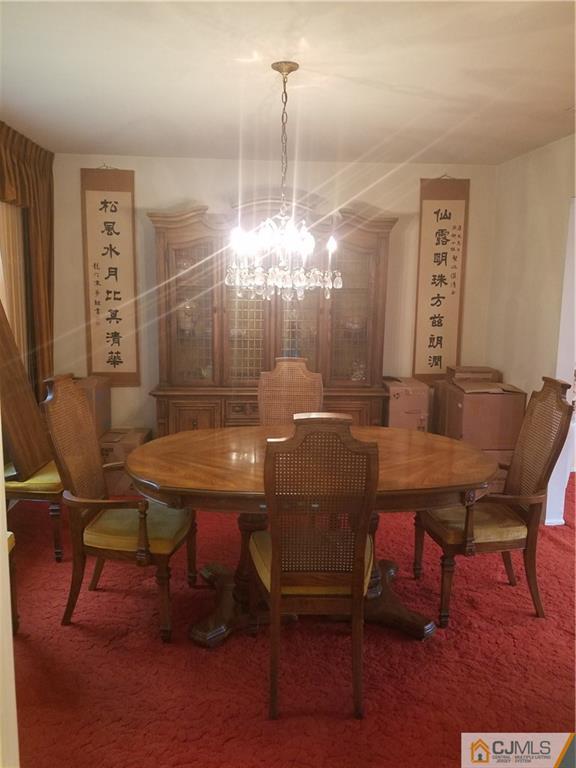 7 Stradford Road Sayreville, NJ 08859 - Photo 10 of 25 a view of a dining room with furniture and wooden floor