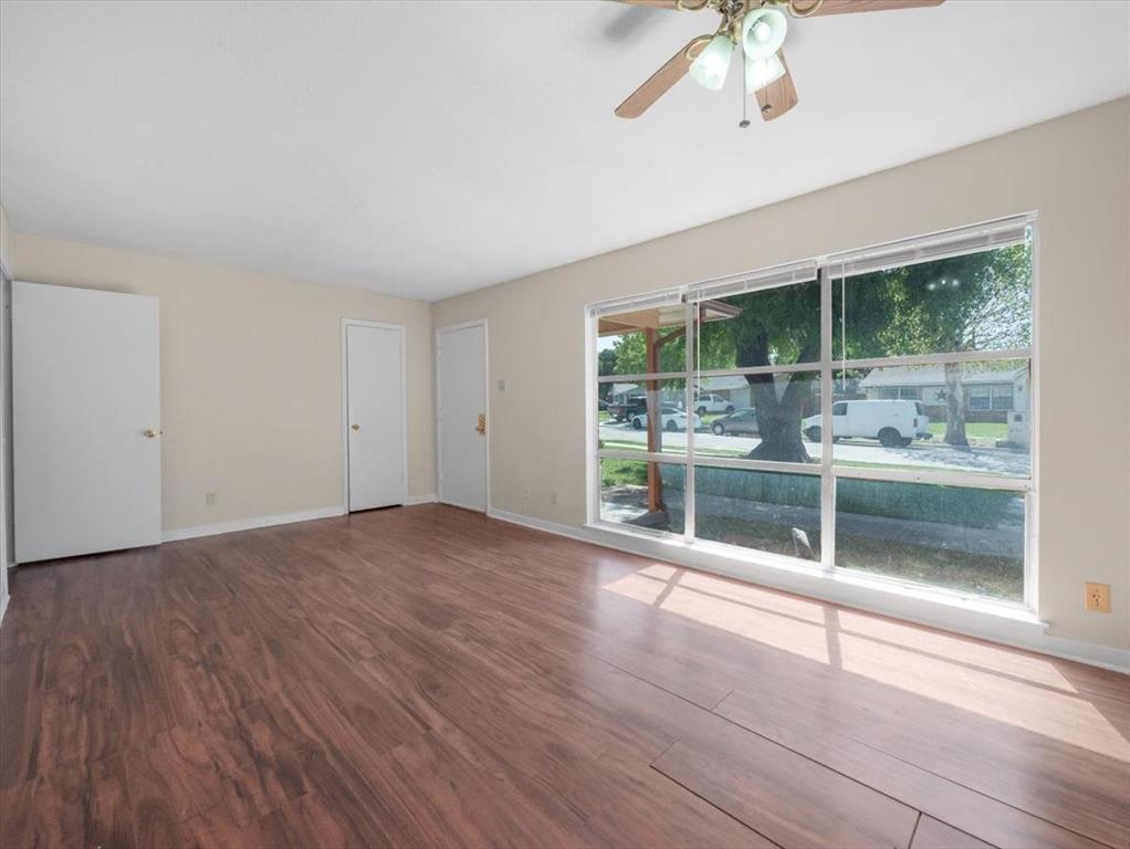 403 Rolando Drive Garland, TX 75040 - Photo 25 of 25 a view of empty room with wooden floor and fan
