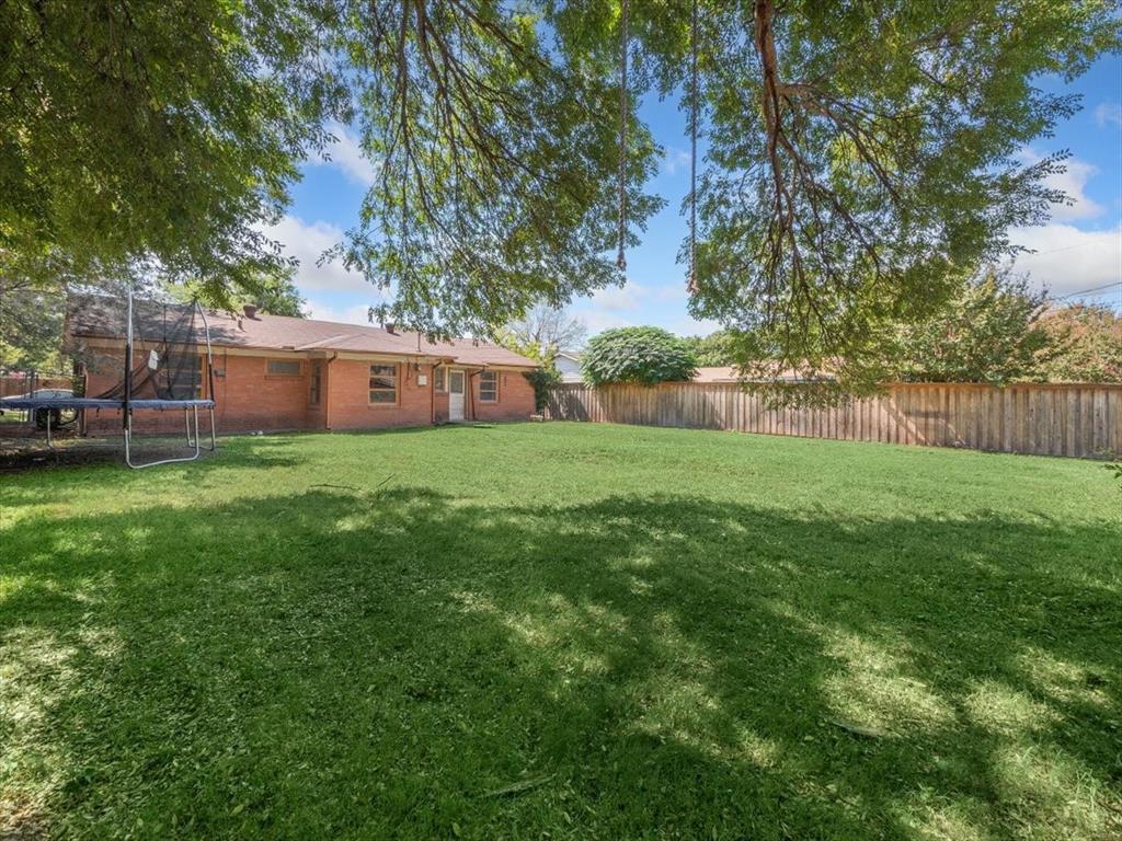 403 Rolando Drive Garland, TX 75040 - Photo 6 of 25 a view of a house with a yard