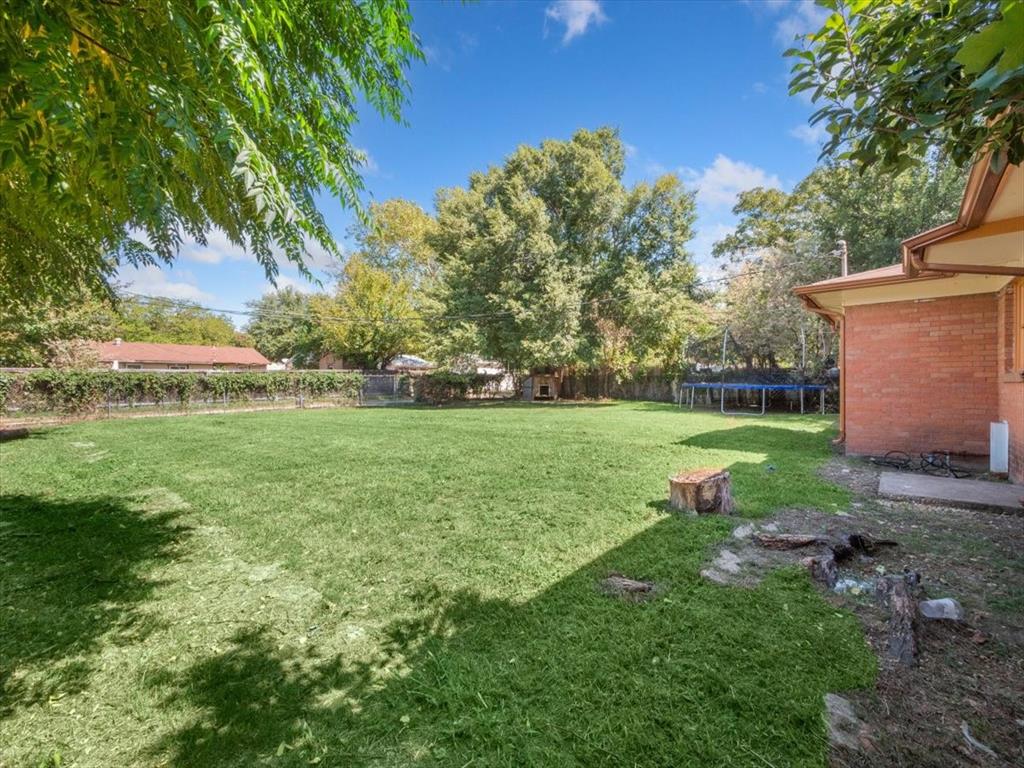 403 Rolando Drive Garland, TX 75040 - Photo 9 of 25 a view of a garden with a building
