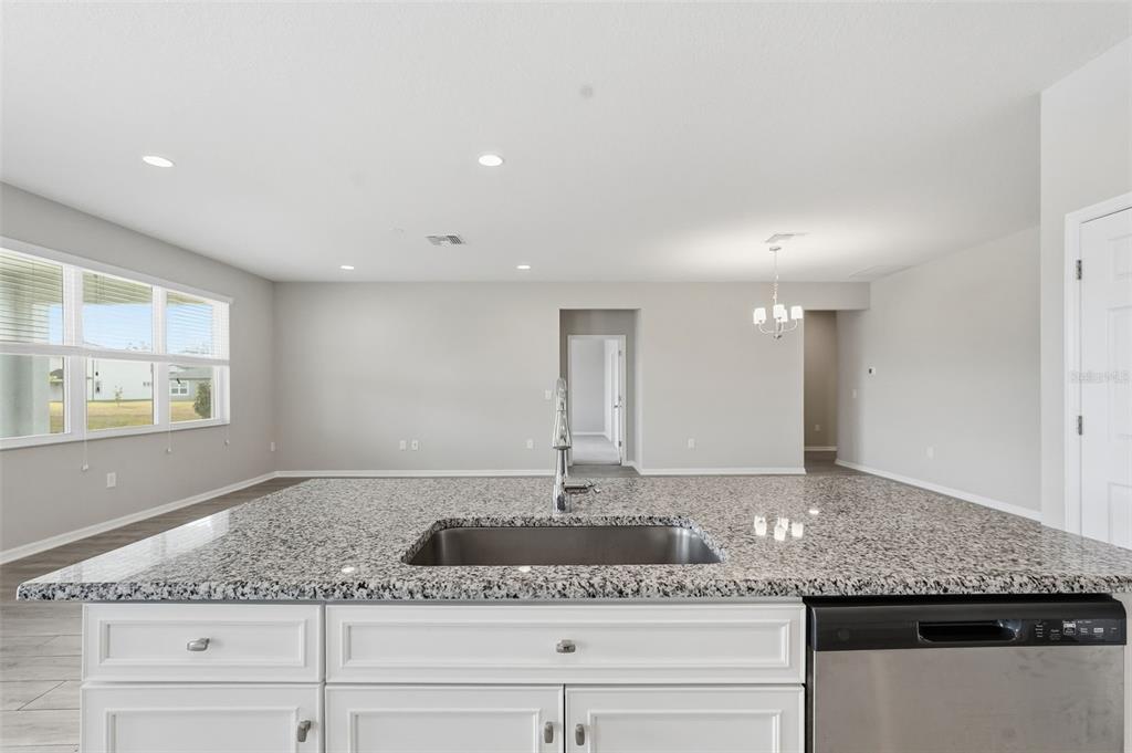 17618 Cortes Creek Boulevard Spring Hill, FL 34610 - Photo 12 of 40 a bathroom with a granite countertop sink and a mirror