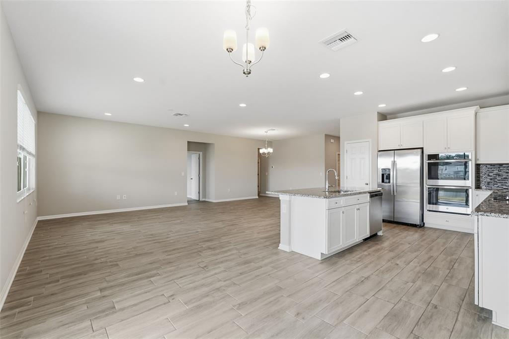 17618 Cortes Creek Boulevard Spring Hill, FL 34610 - Photo 14 of 40 a view of kitchen with wooden floor