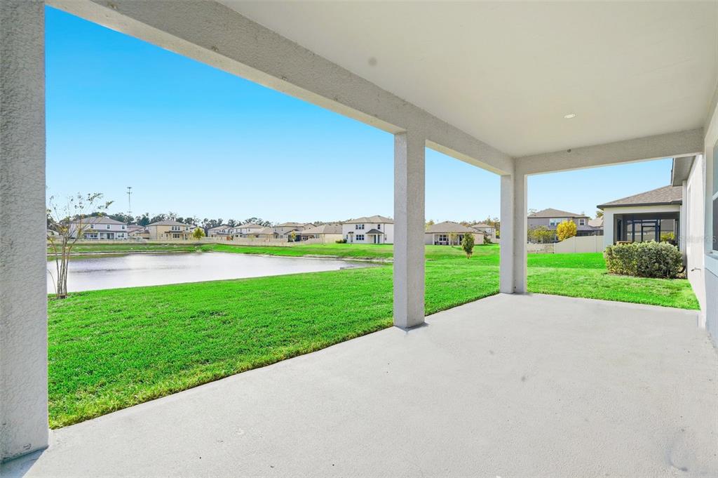 17618 Cortes Creek Boulevard Spring Hill, FL 34610 - Photo 16 of 40 a view of a house with a big yard and potted plants