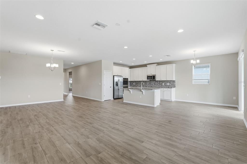 17618 Cortes Creek Boulevard Spring Hill, FL 34610 - Photo 19 of 40 a view of kitchen with kitchen island wooden floor center island and appliances