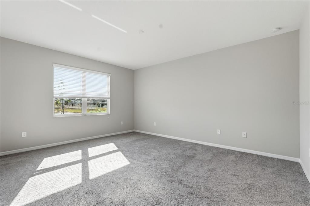 17618 Cortes Creek Boulevard Spring Hill, FL 34610 - Photo 22 of 40 a view of an empty room with a window