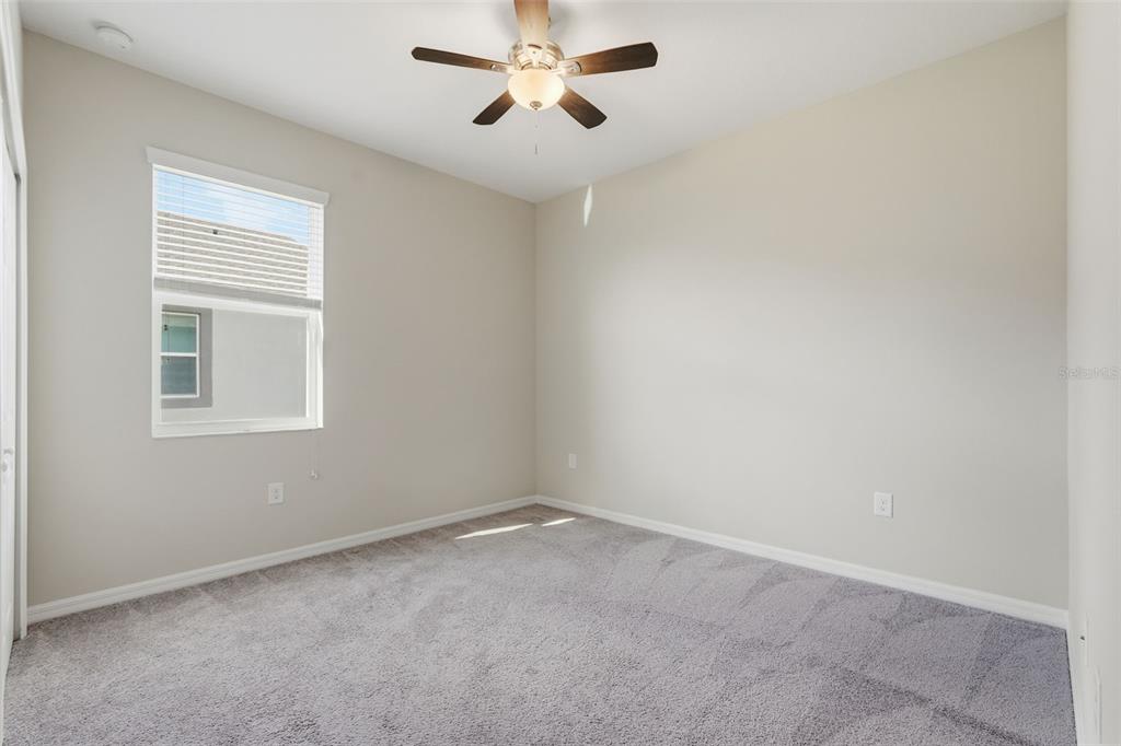 17618 Cortes Creek Boulevard Spring Hill, FL 34610 - Photo 27 of 40 an empty room with a window