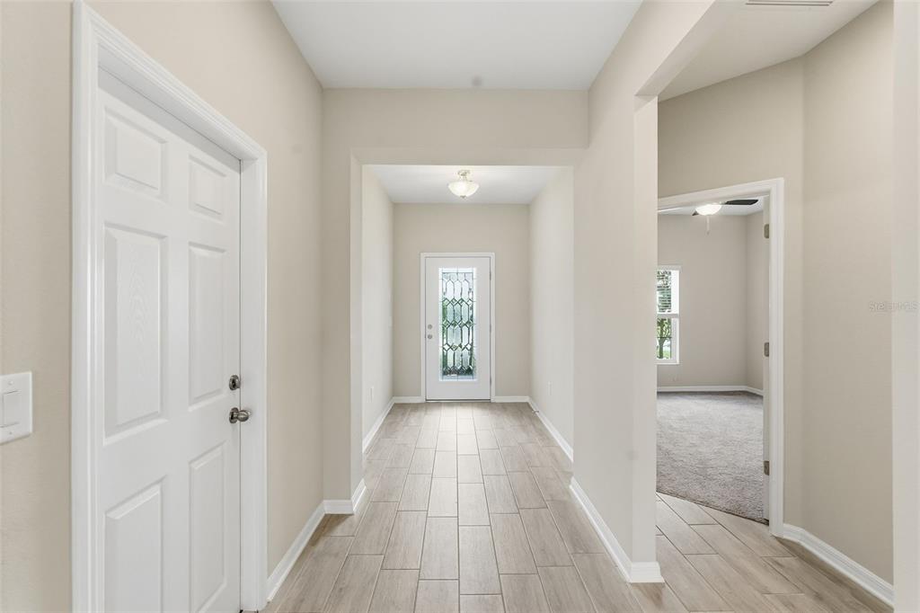 17618 Cortes Creek Boulevard Spring Hill, FL 34610 - Photo 31 of 40 a view of a hallway with wooden floor