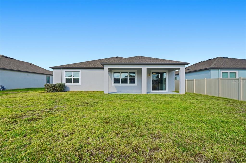 17618 Cortes Creek Boulevard Spring Hill, FL 34610 - Photo 33 of 40 a front view of a house with a garden