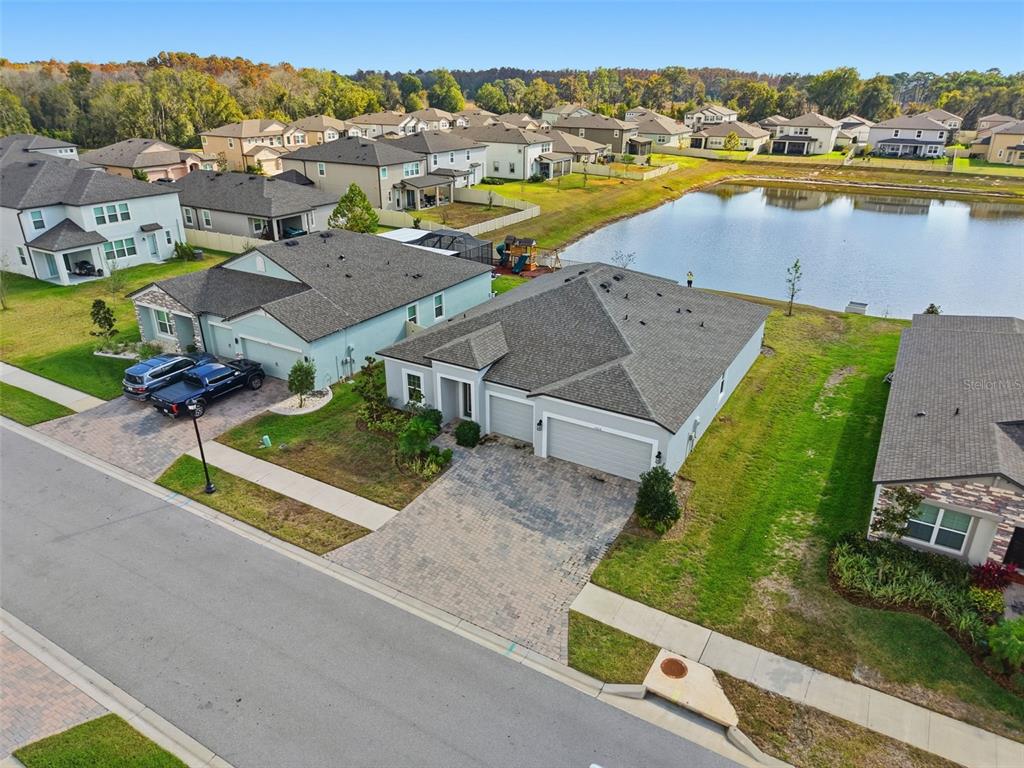 17618 Cortes Creek Boulevard Spring Hill, FL 34610 - Photo 34 of 40 an aerial view of residential houses with outdoor space and river