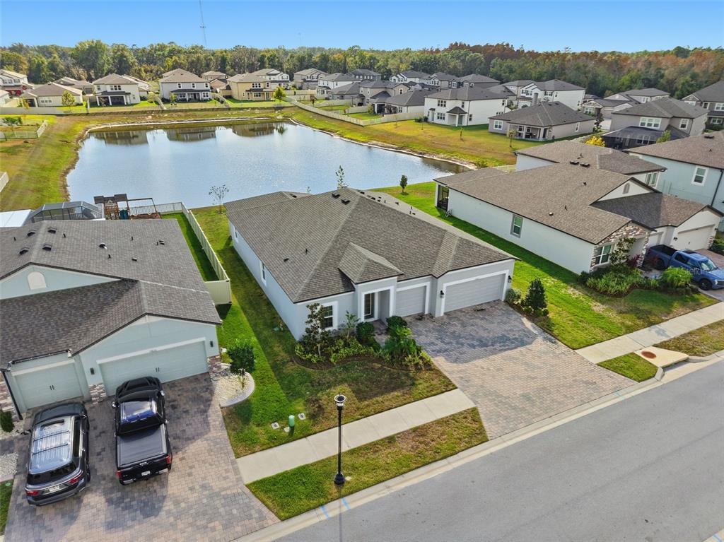 17618 Cortes Creek Boulevard Spring Hill, FL 34610 - Photo 35 of 40 an aerial view of a house with outdoor space and lake view