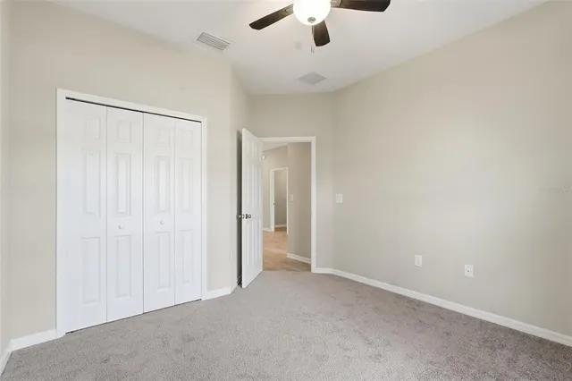 an empty room with fan
