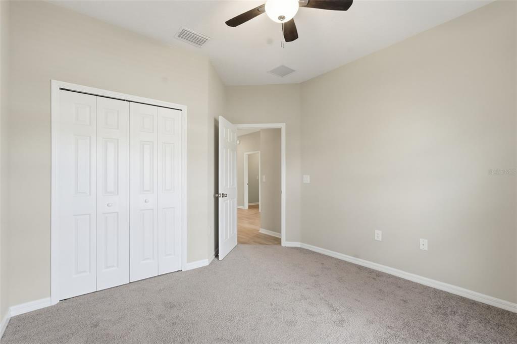 17618 Cortes Creek Boulevard Spring Hill, FL 34610 - Photo 5 of 40 an empty room with fan