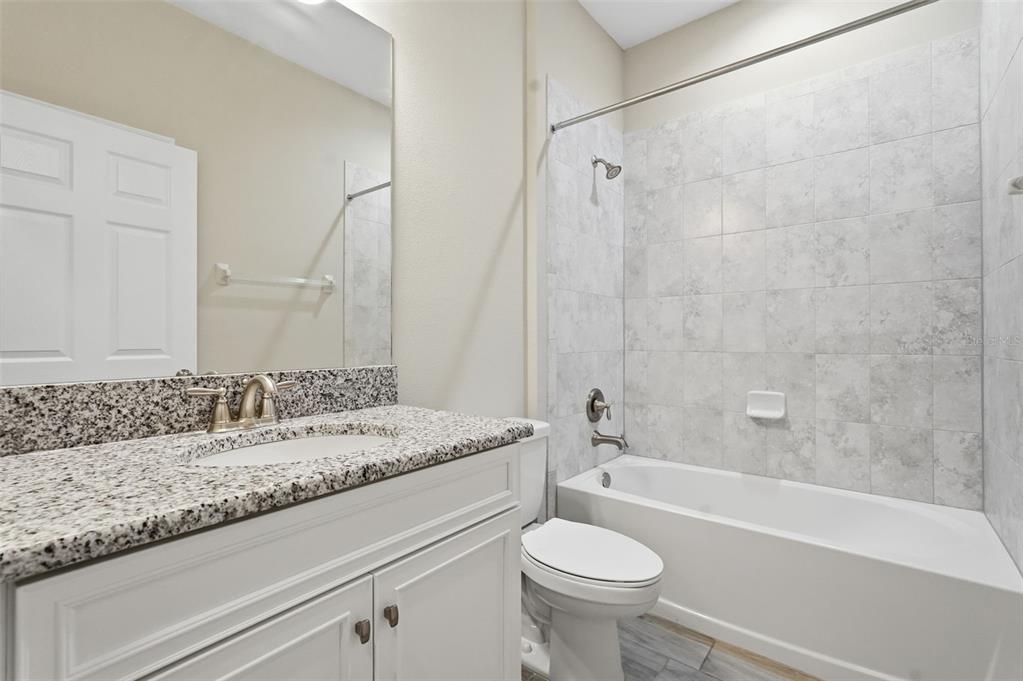 17618 Cortes Creek Boulevard Spring Hill, FL 34610 - Photo 6 of 40 a bathroom with a sink and a bathtub