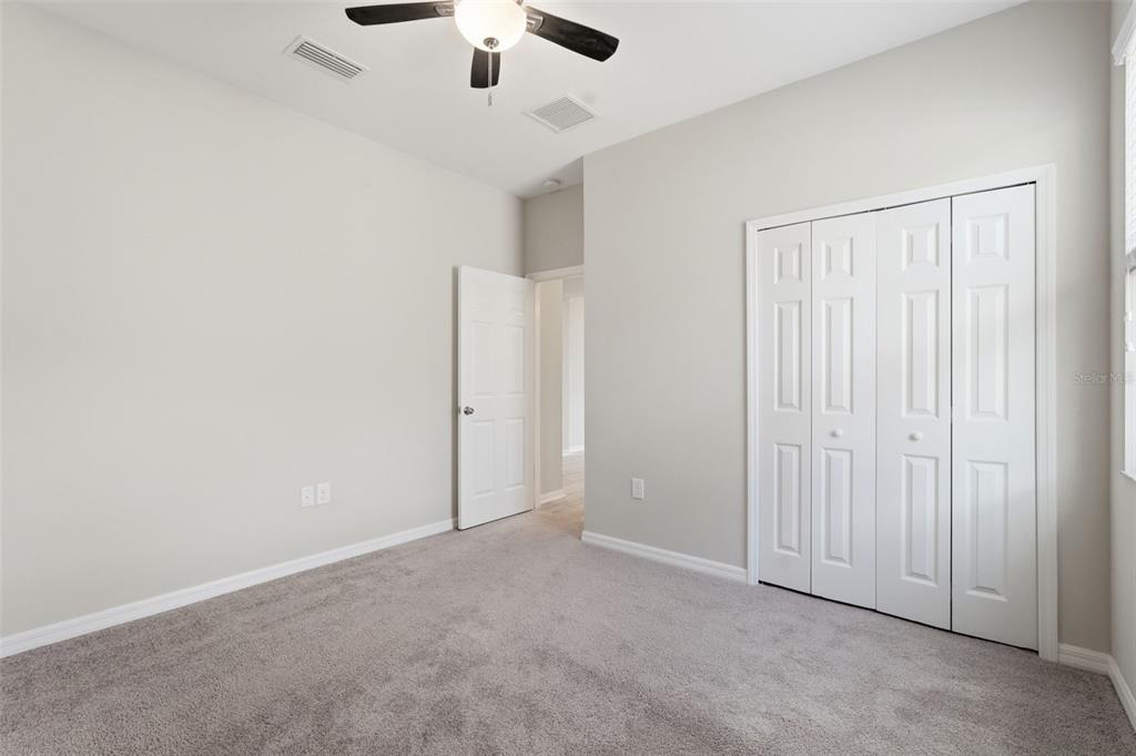 17618 Cortes Creek Boulevard Spring Hill, FL 34610 - Photo 8 of 40 an empty room with chandelier fan