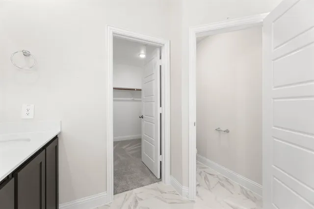 a bathroom with a shower sink and mirror