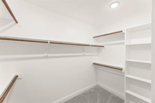 a bathroom with a granite countertop sink mirror and shower