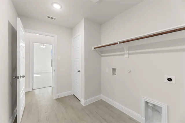 a view of an empty walk in closet