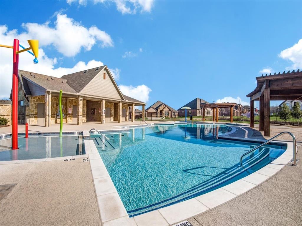 1007 Sedona Trail Justin, TX 76247 - Photo 32 of 40 a view of house with swimming pool outdoor seating