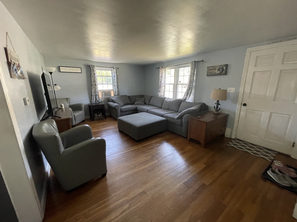109 Oak Street Raynham, MA 02767 - Photo 5 of 9 a living room with furniture window and a wooden floor