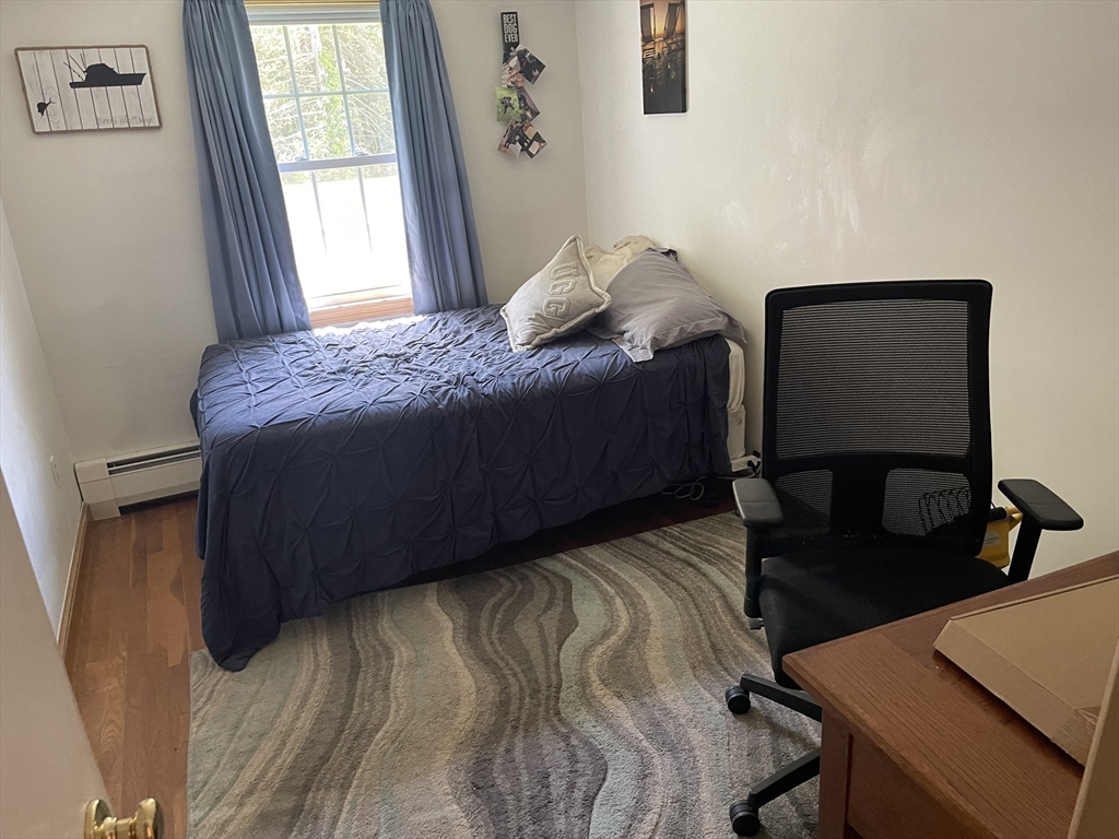 109 Oak Street Raynham, MA 02767 - Photo 6 of 9 a bedroom with a bed and window