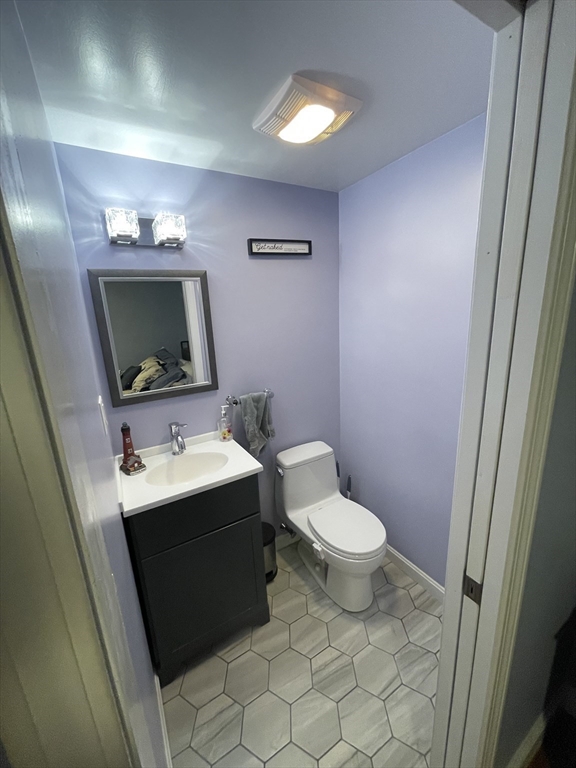 109 Oak Street Raynham, MA 02767 - Photo 8 of 9 a bathroom with a sink toilet and mirror