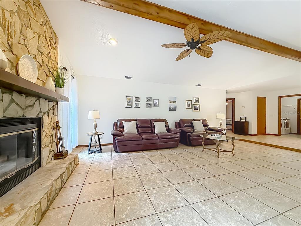 4353 North Indianhead Road Hernando, FL 34442 - Photo 14 of 65 a living room with furniture and a fireplace