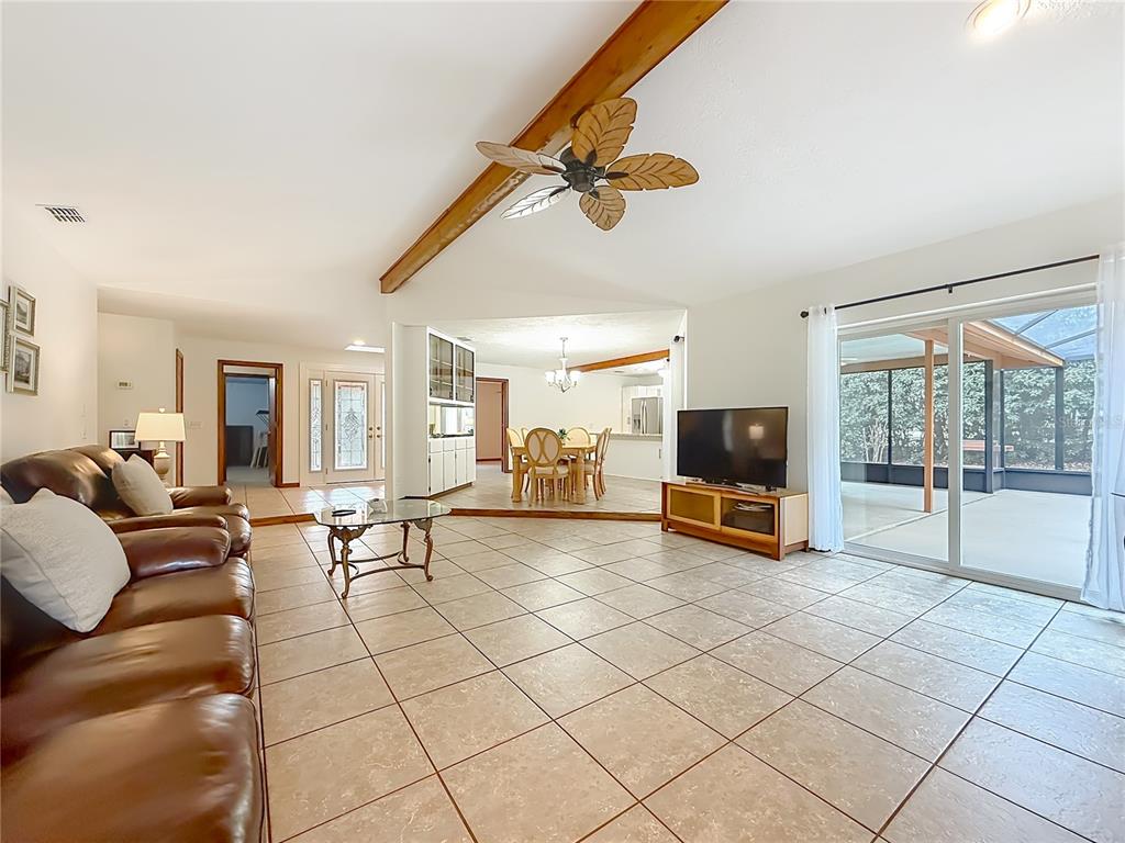 4353 North Indianhead Road Hernando, FL 34442 - Photo 15 of 65 a living room with furniture and a flat screen tv