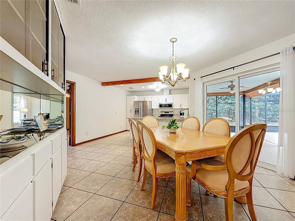 4353 North Indianhead Road Hernando, FL 34442 - Photo 18 of 65 a view of a dining room with furniture window and outside view
