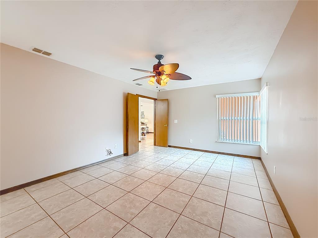 4353 North Indianhead Road Hernando, FL 34442 - Photo 22 of 65 a view of an empty room and chandelier fan