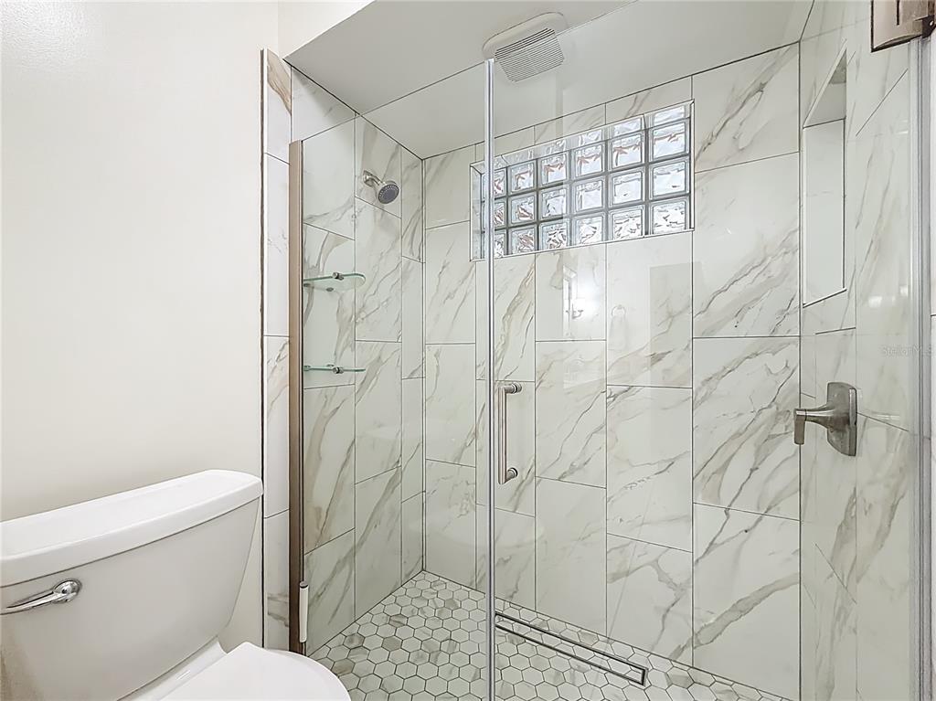 4353 North Indianhead Road Hernando, FL 34442 - Photo 27 of 65 a bathroom with a shower toilet and sink