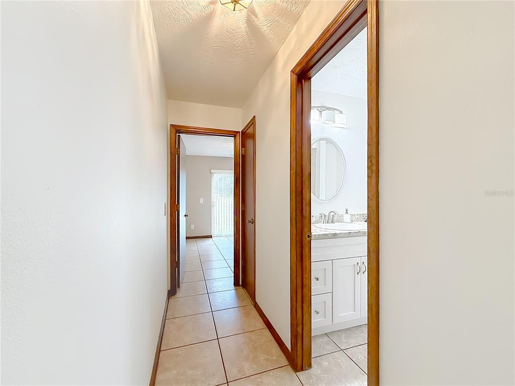 4353 North Indianhead Road Hernando, FL 34442 - Photo 36 of 65 a view of a bathroom from a hallway