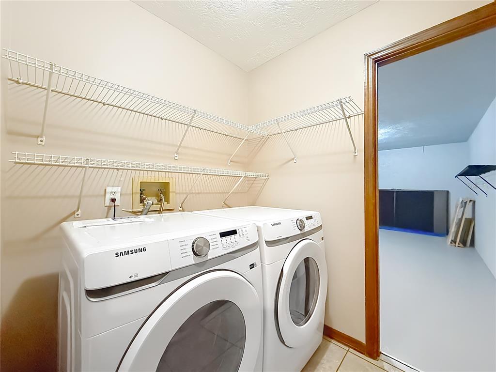 4353 North Indianhead Road Hernando, FL 34442 - Photo 39 of 65 a utility room with dryer and washer