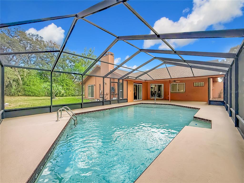 4353 North Indianhead Road Hernando, FL 34442 - Photo 47 of 65 a view of swimming pool with a yard