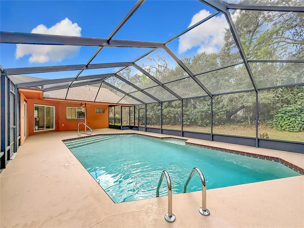 4353 North Indianhead Road Hernando, FL 34442 - Photo 48 of 65 a view of a swimming pool with a porch