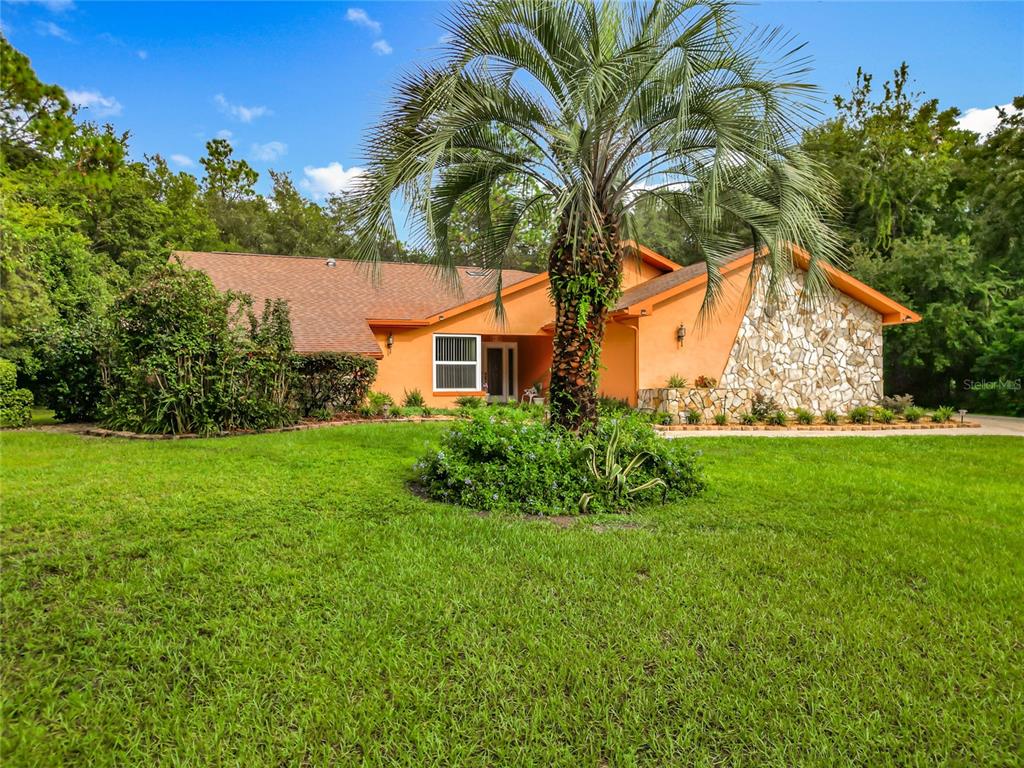 4353 North Indianhead Road Hernando, FL 34442 - Photo 49 of 65 a view of a house with a yard