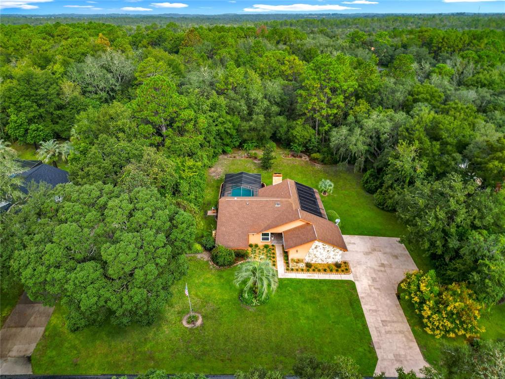 4353 North Indianhead Road Hernando, FL 34442 - Photo 55 of 65 an aerial view of a house with yard