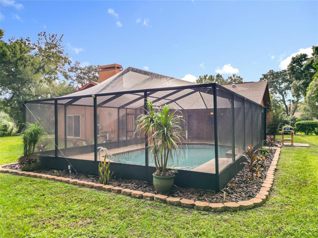 4353 North Indianhead Road Hernando, FL 34442 - Photo 58 of 65 a front view of house with yard and outdoor seating