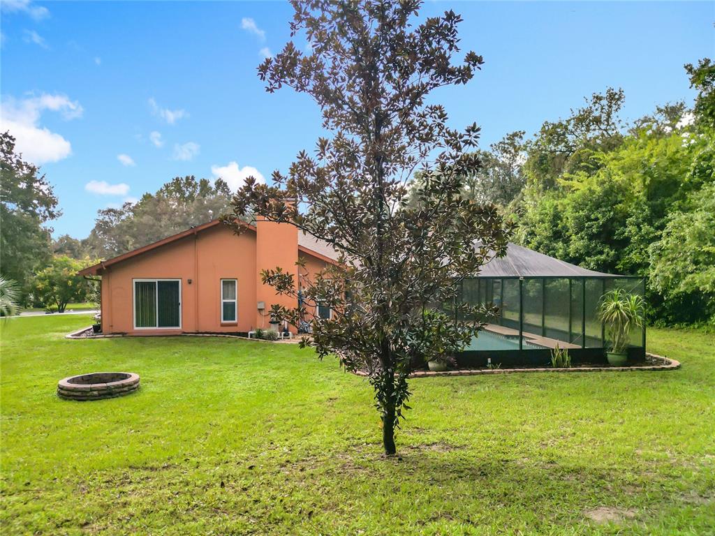 4353 North Indianhead Road Hernando, FL 34442 - Photo 59 of 65 a view of a house with a yard