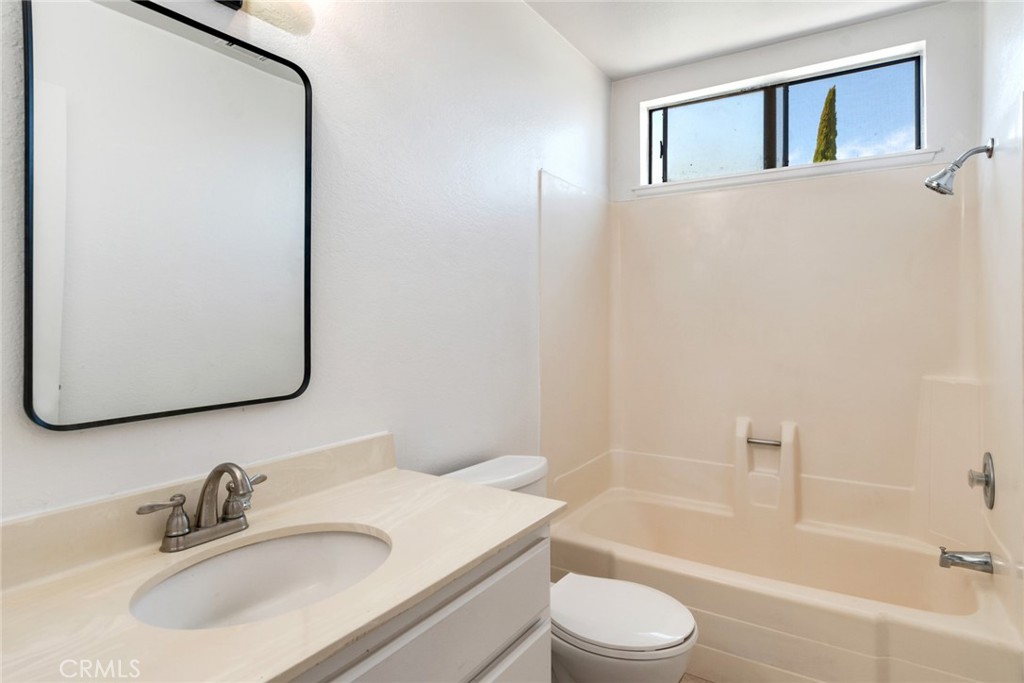 2767 Attenborough Place Riverside, CA 92503 - Photo 14 of 39 a bathroom with a sink toilet and shower