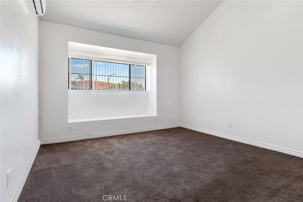 2767 Attenborough Place Riverside, CA 92503 - Photo 15 of 39 an empty room with wooden floor and windows