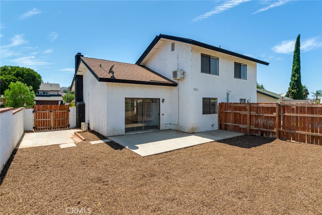 2767 Attenborough Place Riverside, CA 92503 - Photo 20 of 39 a front view of a house with a garage