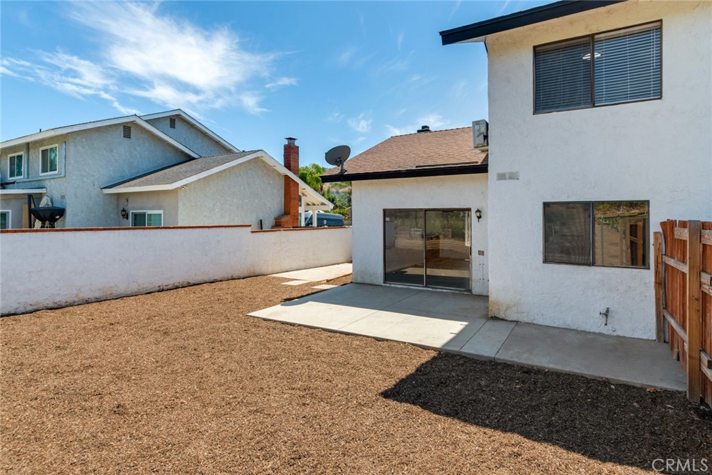 2767 Attenborough Place Riverside, CA 92503 - Photo 21 of 39 a view of a house with a yard and garage
