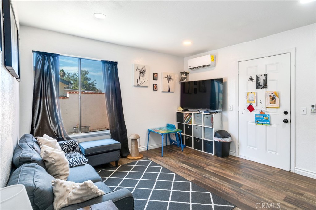 2767 Attenborough Place Riverside, CA 92503 - Photo 22 of 39 a living room with furniture and a flat screen tv