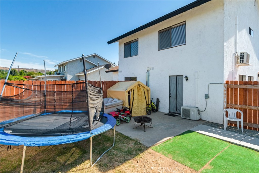2767 Attenborough Place Riverside, CA 92503 - Photo 28 of 39 a view of a backyard with a tub and chair
