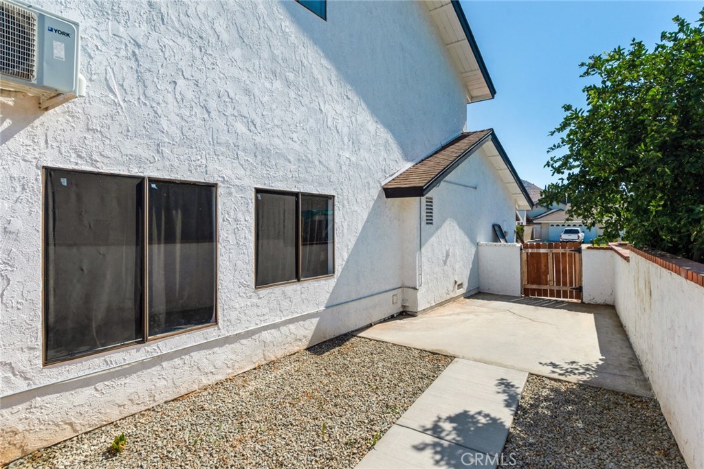 2767 Attenborough Place Riverside, CA 92503 - Photo 29 of 39 a view of a house with a wooden fence