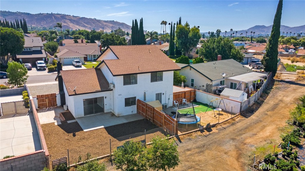 2767 Attenborough Place Riverside, CA 92503 - Photo 34 of 39 an aerial view of a house with a garden and mountain view