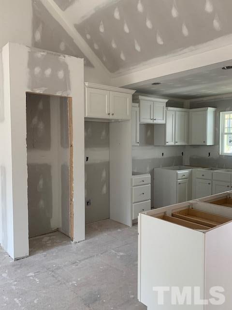 1321 Cobb Road Angier, NC 27501 - Photo 6 of 14 a kitchen that has a sink a refrigerator and cabinets