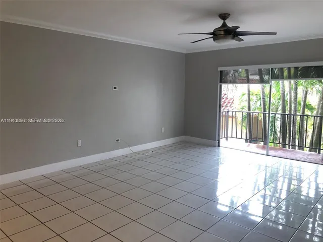 a view of an empty room and a window