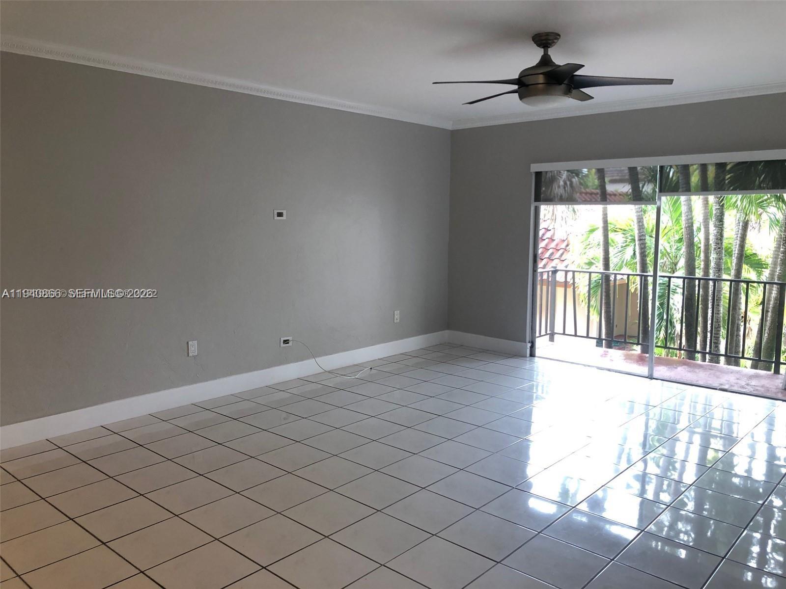 9350 Southwest 77th Avenue, Unit G8 Miami, FL 33156 - Photo 2 of 11 a view of an empty room and a window